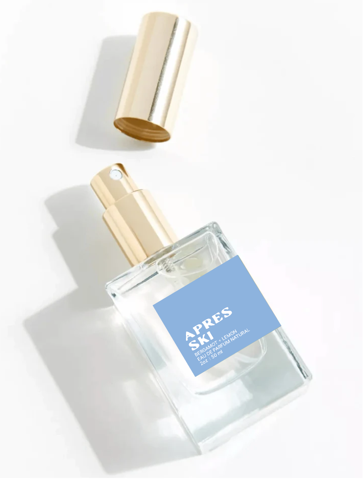 Perfume bottle labeled 'Apres Ski' with a gold cap on a white background