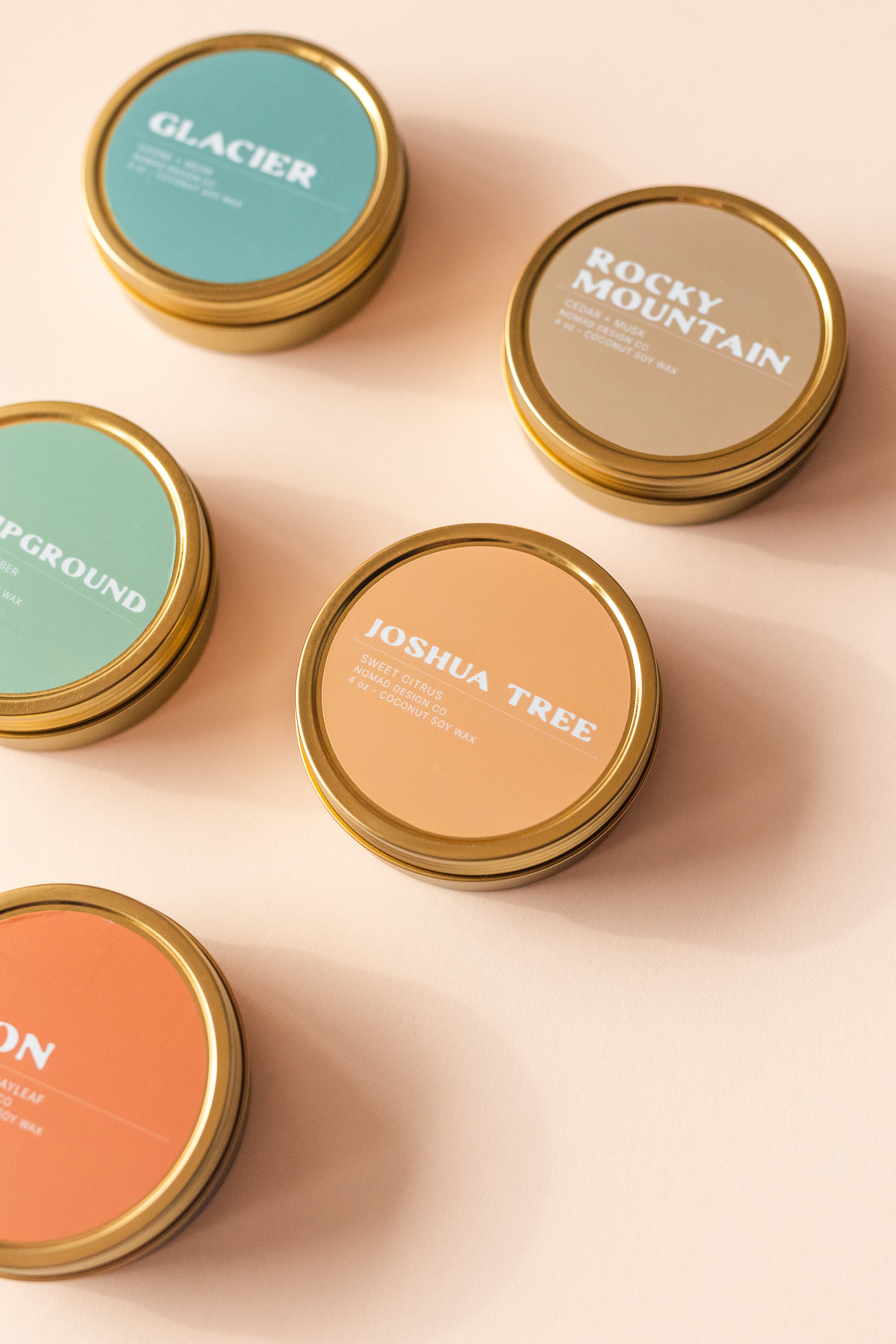 a collection of National Park themed travel tin candles